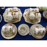 A Royal Albert Crown China 'Fruit' pattern teaset comprising; twelve cups, saucers and plates,