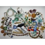 A collection of vintage costume jewellery to include, a Japanese black plastic Zeppelin brooch,