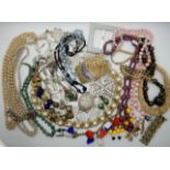 A collection of vintage costume jewellery to include, glass cameo earrings, a large Deco buckle,