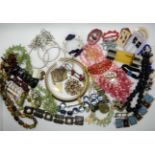 A collection of vintage costume jewellery to include, enamelled bracelet, Iona marble beads, large