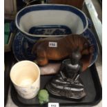 A carved wood figure of an ox, resin figure of Buddha, a dog of fo, Willow pattern platter, blue and