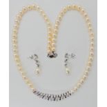 An 18ct white gold spiral detail diamond and pearl necklace and earring set, the approximate