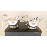 A cased pair of silver sauce boats by Edwards & Sons, Birmingham 1931, of standard form with
