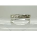 An 18ct white gold half eternity ring set with estimated approx 0.18cts of diamonds, size Q1/2