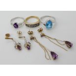 A 9ct blue topaz ring size R1/2, a 9ct blue gem ring N1/2, two pairs of amethyst drop earrings and