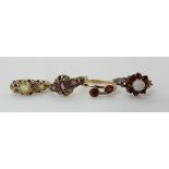 A 9ct gold garnet and pearl ring, size O1/2, a further similar yellow metal gem set ring size J, a
