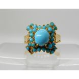 A turquoise set yellow metal ring stamped indistinctly size O (one small turquoise lacking) weight