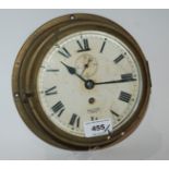 A brass Smiths Empire bulkhead clock, 19cm diameter and a pair of binoculars (2) Condition Report: