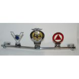 Three metal car mascots on metal chrome bar Condition Report: Available upon request