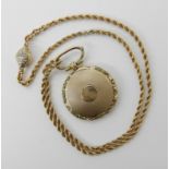 A yellow metal locked inscribed with the date 1840, together with a bright yellow metal chain with