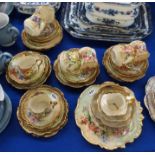 A Nautilus porcelain handpainted teaset decorated with different flowers comprising; eight cups,