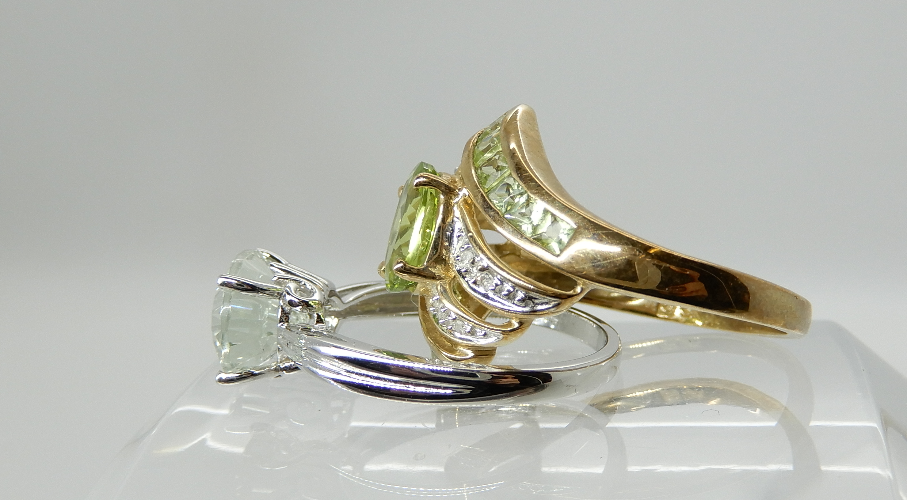 A 9ct gold peridot and diamond dress ring size Q1/2 and a 9ct white gold pale blue gemstone ring, - Image 3 of 3