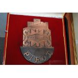 A cased bronzed Pirot plaque, guest book etc Condition Report: Available upon request