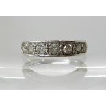 An 18ct white gold seven stone diamond ring each diamond estimated approx 0.10cts (three diamonds