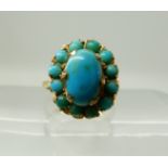 A bright yellow metal turquoise set ring, size F, weight 2.7gms Condition Report: Available upon