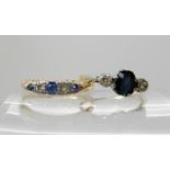 A bright yellow metal sapphire and diamond ring size S1/2 and a bright yellow metal sapphire and