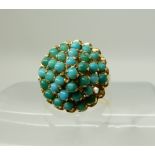 A bright yellow metal turquoise cluster ring (one small turquoise lacking) size O1/2 Condition