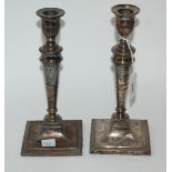 A lot comprising three pairs of silver plated candlesticks, the tallest 27cm high Condition