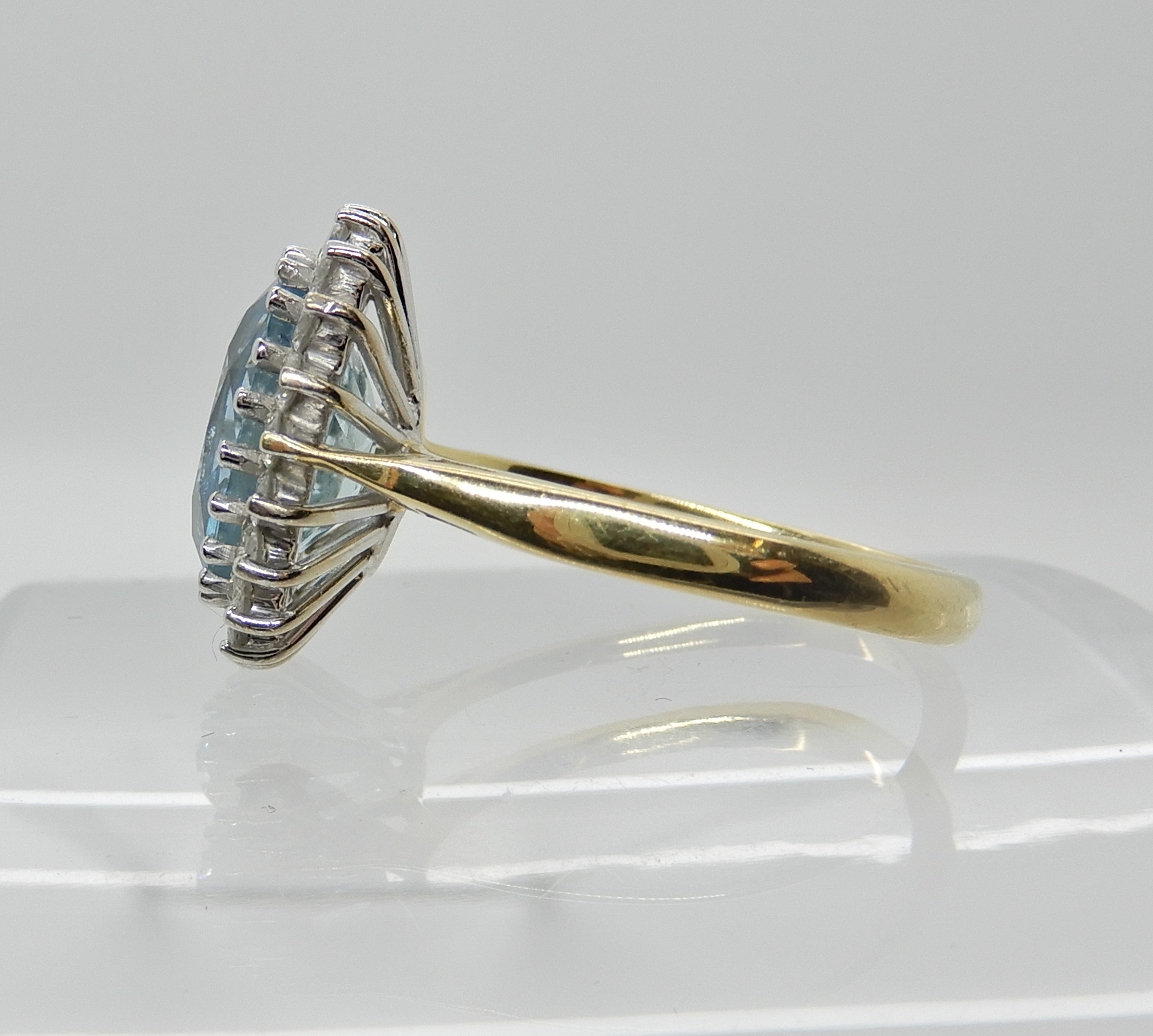 An 18ct gold aquamarine and diamond cluster ring dimensions of the aqua approx 11mm x 9mm x 5.4mm, - Image 3 of 3