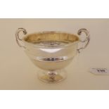 A silver twin handled bowl by E Hill, Birmingham 1913, of circular form on pedestal base, 10.7cm