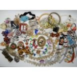A collection of vintage costume jewellery to include, a feather work bird brooch, a Trifari necklace