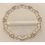 A silver card tray by Emile Viner, Sheffield 1890, of circular form with scalloped edge on three