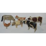 A collection of late 19th Century carved wood farm animals, barns, fences, trees, possibly by