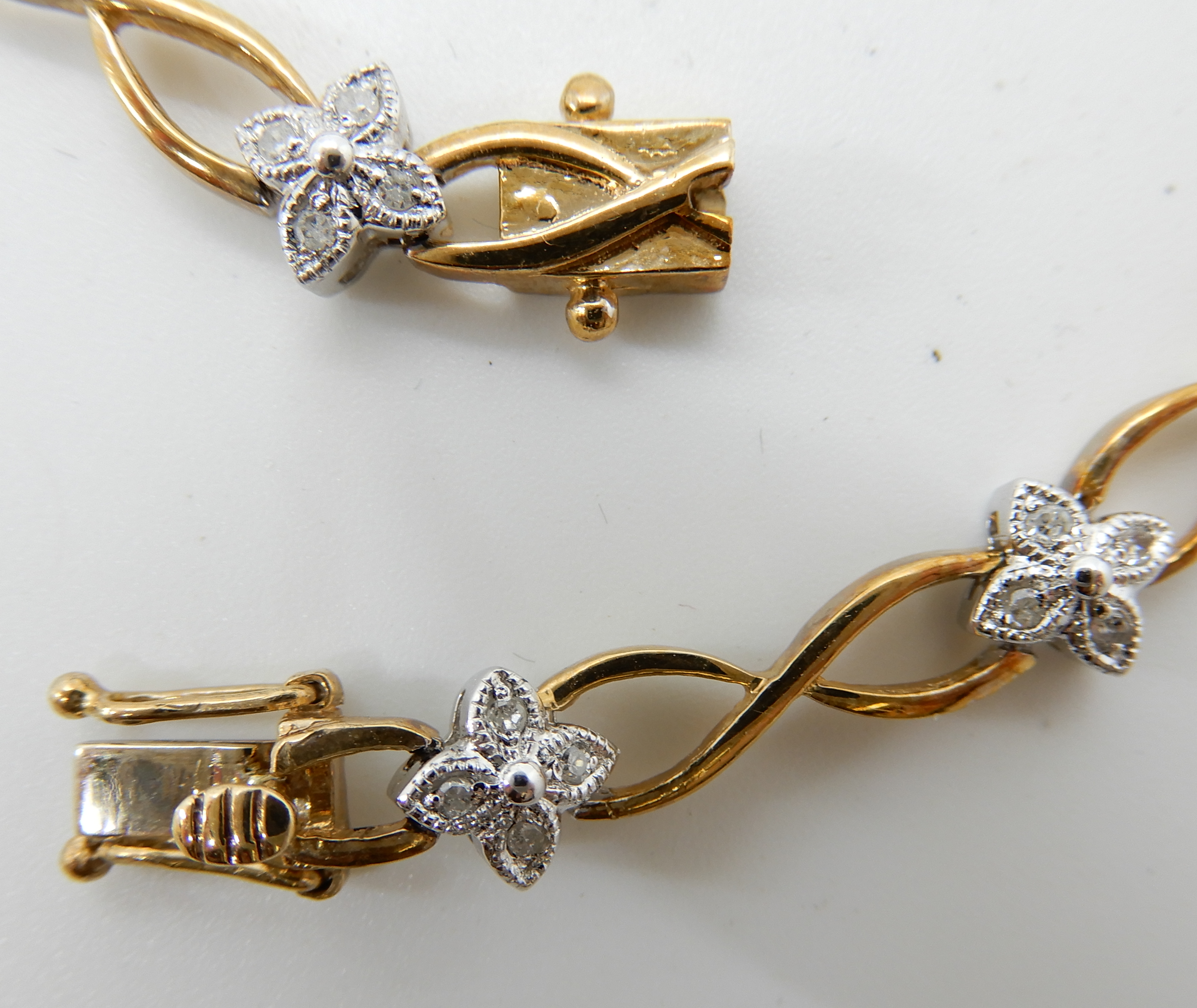 A 9ct gold diamond flower bracelet, set with 0.25cts of eight cut diamonds, length 18cm, weight 8. - Image 2 of 3