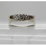 An 18ct five stone diamond ring (one diamond lacking) set with estimated approx 0.45cts of diamonds,