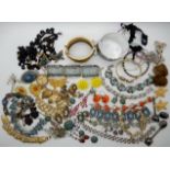 A collection of vintage costume jewellery to include, a Masonic eastern star bangle, a gold plated