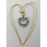 A 14k gold rope chain length 44cm, with a yellow metal blue gem set heart shaped pendant weight 4.