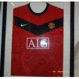 A replica 2008-09 Manchester United autographed shirt, framed and glazed with COA Condition