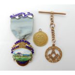 A 9ct gold Masonic short fob chain, weight 8.2gms and a very worn one pond coin weight 7.5gms,