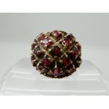 A 9ct gold garnet cluster ring, size P1/2, weight 8.1gms Condition Report: Available upon request