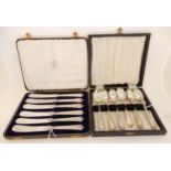 A lot comprising a cased set of six silver handled butter knives, Sheffield marks and a cased set of