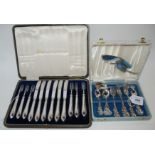 A lot comprising a cased fifteen piece silver dessert set, marked 952 and a cased silver handled
