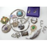 A white metal horseshoe brooch, filigree galleon brooch, silver marcasite brooch and other items