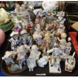 A collection of Continental porcelain figures including German fairing 'Which is Prettiest',