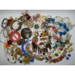 A collection of vintage costume jewellery to include, a French ceramic poodle necklace, tigers eye