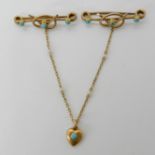 A bright yellow metal lover's knot and heart double brooch set with turquoise, joined by a pearl set