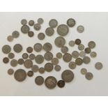 A quantity of pre'47 British coins, half crowns, shillings, sixpences and silver threepennies,