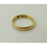 An 18ct gold court wedding band, size L, weight 4.1gms Condition Report: Available upon request