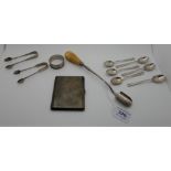 A lot comprising a silver cheese spoon with wood handle, rubbed marks, two pairs of silver tongs,