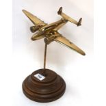 A brass model of a military aircraft Condition Report: Available upon request