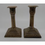 A pair of Victorian silver candlesticks, rubbed marks, probably London 1896, with removable sconces,