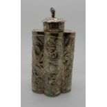 A Burmese white metal tea caddy, unidentified marks on the base, the cylindrical lobed body embossed