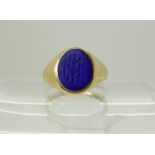 An 18ct gold signet ring mounted with a monogrammed lapis lazuli, size I1/2, weight 4.3gms Condition