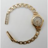 A 9ct gold ladies vintage watch, length of strap 16cm, weight including mechanism 14gms Condition