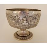 A Burmese white metal pedestal bowl with embossed decoration, 14cm diameter, 339gms Condition