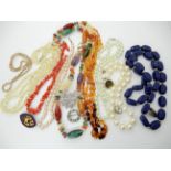 Coral beads, amber beads and a collection of costume jewellery Condition Report: Not available for